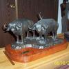 Two Cape buffalo bulls, an example of two sculptures in combination for a more powerful piece.  $2,850.00.